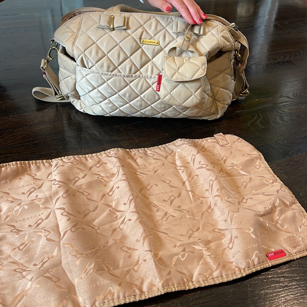 Storksak diaper bag with changing mat and pacifier holder